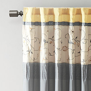 Add simple elegance to any room with the Madison Park Serene Embroidered Window Panel. This window curtain features delicate floral embroidery in soft sage and neutral hues, offering beautiful contrast for a sophisticated look. The pieced and pleated details provide extra dimension and charm to your home decor, while added lining helps filter the perfect amount of sunlight into your home. Simply hang with rod pocket or backs tabs for a tailored look. Fits up to a 1.25" diameter rod.Imported | Embroidery | Pieced and pleated detailing | Added polyester lining | Rod pocket and back tabs