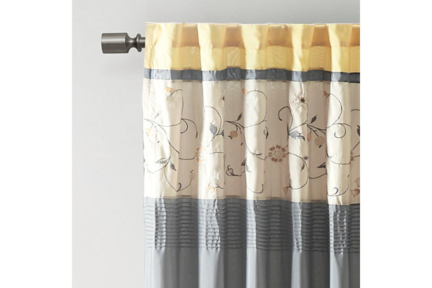 Add simple elegance to any room with the Madison Park Serene Embroidered Window Panel. This window curtain features delicate floral embroidery in soft sage and neutral hues, offering beautiful contrast for a sophisticated look. The pieced and pleated details provide extra dimension and charm to your home decor, while added lining helps filter the perfect amount of sunlight into your home. Simply hang with rod pocket or backs tabs for a tailored look. Fits up to a 1.25" diameter rod.Imported | Embroidery | Pieced and pleated detailing | Added polyester lining | Rod pocket and back tabs
