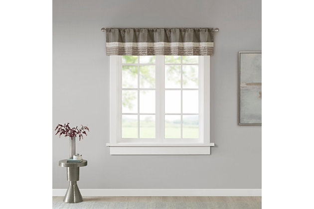 Madison Park Amherst Polyoni Pintuck Window Valance is a simple way to add style to your room. This window valance features a modern striped design in natural hues of ivory, taupe, and mocha combined with pintuck detailing for beautiful texture and dimension. The added lining helps filter the perfect amount of light and creates fullness for better drapability. Finished with a rod pocket top, this window valance fits up to a 1.25" diameter rod.Imported | Pieced and pintuck detailing | Added lining filtering light and for better drapability | Rod pocket top finish