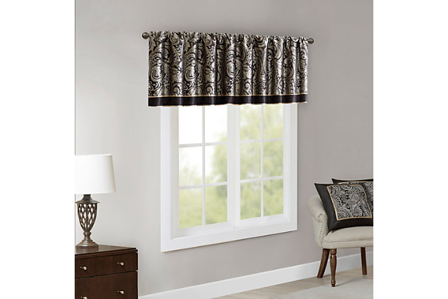 For a luxuriously classic style, our Madison Park Aubrey Window Valance is the perfect touch to your decor. The alluring jacquard weave is inspired from an updated paisley motif and is woven in beautiful hues of black, gold, and a hint of platinum for a shimmering accent. The window valance are pieced with solid faux silk and beautiful flat piping details in gold, creating an elegant look. Simply hang on rod pocket; fits up to a 1.25 diameter rod.Imported | Paisley jacquard weave design | Pieced border detailing | Rod pocket top finish