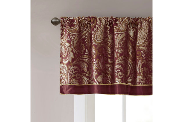 For a luxuriously classic style, our Madison Park Aubrey Window Valance is the perfect touch to your decor. The alluring jacquard weave is inspired from an updated paisley motif and is woven in beautiful hues of burnt red, gold, and a hint of platinum for a shimmering accent. The window valance are pieced with solid faux silk and beautiful flat piping details in gold, creating an elegant look. Simply hang on rod pocket; fits up to a 1.25 diameter rod.Imported | Paisley jacquard weave design | Pieced border detailing | Rod pocket top finish