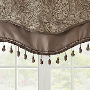 For a unique and luxuriously classic style, our Madison Park Aubrey Beaded Valance is the perfect extra touch to your decor. 
The alluring jacquard weave is inspired from an updated paisley motif and is woven in beautiful hues of blue, taupe, and a hint of silver for a shimmering accent. 
The window valance features solid faux silk piecing and flat piping details, while delicately finished with a scalloped bottom design and intricate gold bead trim, creating an intriguing elegant look. This window panel is also OEKO-TEX certified, meaning it does not contain any harmful substances or chemicals, ensuring quality comfort and wellness. 
Simply hang on rod pocket; fits up to a 1.25 diameter rod.Imported | Paisley jacquard design valance | Piping and contrast solid border detailing | Scalloped bottom design with bead trimming | Oeko-tex certified, includes no harmful substances or chemicals (#sh025 157066) | Fits up to 1.25 inches rod diameter | Machine washable