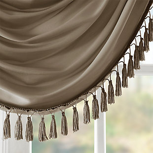 Bring style and sophistication to your windows, with our Elena Waterfall window valance. This classy bronze valance showcases rich center draping details and a beautiful tassel trim, combined with the faux silk fabric for a rich sheen and stylish update. Features added lining and a rod pocket top finish; fits up to 1.25" diameter rod. Part of our decorative valance collection, this valance is perfect as a stylish addition to any small window or even better as a layering piece to dress up any window panel. This window valance is also OEKO-TEX certified, meaning it does not contain any harmful substances or chemicals, ensuring quality comfort and wellness. Multiple valances used to create this look.Imported | Faux silk luxe light sheen fabric window valance | Center waterfall drape design | Fits up 1.25" diameter rod | Tassel trim embellishment detailing | Oeko-tex certified, includes no harmful substances or chemicals (# bj025 173578) | Added lining for finish touch | Coordinating window panel available and sold separately | Machine washable for easy care