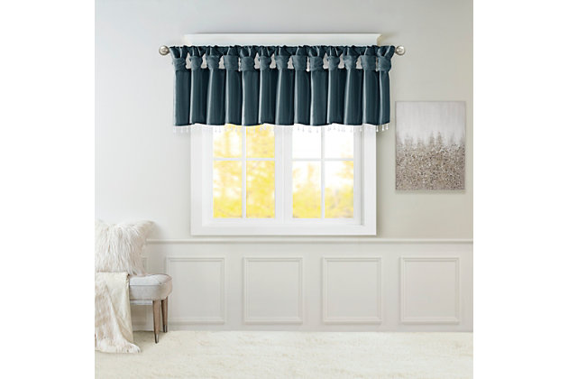 Give your home a decorator’s touch with the Madison Park Emilia Window Valance. Made from a faux silk fabric, this elegant window valance features a DIY twist tab top finish that creates rich deep folds, combined with a beautiful bead trim for an alluring charm. Added lining offers more privacy and a fuller appearance, while the luxurious sheen and jewel teal tone provides a touch of sophistication to your decor. Easy to hang, this tab top valance updates any decor into subtle glamour. Hanging instructions are included. Fits up to a 2" diameter rod.Imported | Transitional valance in solid faux silk with beads | Coordinating to the window curtain in various colors and sizes | Diy twisted tab top finish that fits up to 2 inches rod diameter | Lined for privacy and drapability | Need 2 valances for each window | Machine washable