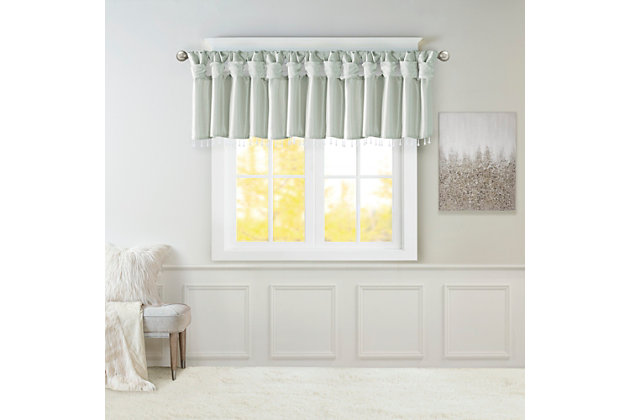 Give your home a decorator’s touch with the Madison Park Emilia Window Valance. Made from a faux silk fabric, this elegant window valance features a DIY twist tab top finish that creates rich deep folds, combined with a beautiful bead trim for an alluring charm. Added lining offers more privacy and a fuller appearance, while the luxurious sheen and dusty aqua tone provides a touch of sophistication to your decor. Easy to hang, this tab top valance updates any decor into subtle glamour. Hanging instructions are included. Fits up to a 2" diameter rod.Imported | Transitional valance in solid faux silk with beads | Coordinating to the window curtain in various colors and sizes | Diy twisted tab top finish that fits up to 2 inches rod diameter | Lined for privacy and drapability | Need 2 valances for each window | Machine washable
