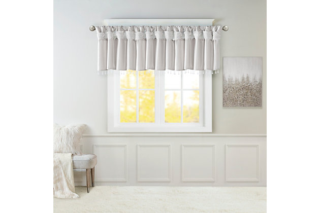 Give your home a decorator’s touch with the Madison Park Emilia Window Valance. Made from a faux silk fabric, this elegant window valance features a DIY twist tab top finish that creates rich deep folds, combined with a beautiful bead trim for an alluring charm. Added lining offers more privacy and a fuller appearance, while the luxurious sheen and rich silver tone provides a touch of sophistication to your decor. Easy to hang, this tab top valance updates any decor into subtle glamour. Hanging instructions are included. Fits up to a 2" diameter rod.Imported | Transitional valance in solid faux silk with beads | Coordinating to the window curtain in various colors and sizes | Diy twisted tab top finish that fits up to 2 inches rod diameter | Lined for privacy and drapability | Need 2 valances for each window | Machine washable
