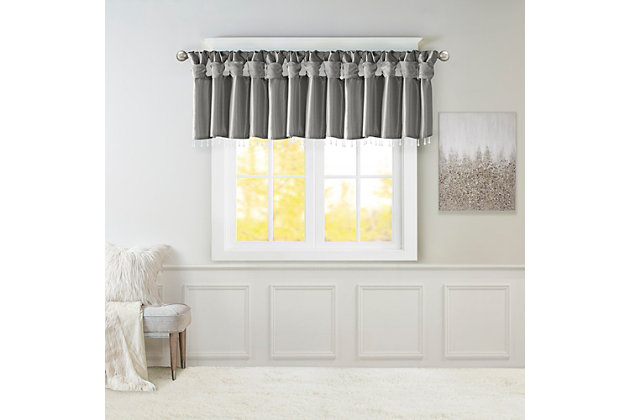 Give your home a decorator’s touch with the Madison Park Emilia Window Valance. Made from a faux silk fabric, this elegant window valance features a DIY twist tab top finish that creates rich deep folds, combined with a beautiful bead trim for an alluring charm. Added lining offers more privacy and a fuller appearance, while the luxurious sheen and rich charcoal tone provides a touch of sophistication to your decor. Easy to hang, this tab top valance updates any decor into subtle glamour. Hanging instructions are included. Fits up to a 2" diameter rod.Imported | Transitional valance in solid faux silk with beads | Coordinating to the window curtain in various colors and sizes | Diy twisted tab top finish that fits up to 2 inches rod diameter | Lined for privacy and drapability | Need 2 valances for each window | Machine washable