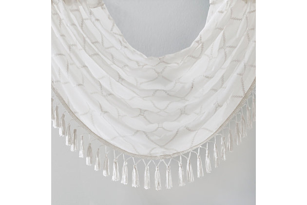 Madison Park’s Irina Diamond Sheer Waterfall Valance provides an alluring update to your home. An elegant diamond pattern is beautifully embroidered on a soft sheer fabric, adding grace and charm to your décor. The neutral colors and light fabric helps create a delicate look to soften any room, combined with the beautiful tassel trim and rich draping details, makes this the perfect dressing to any window. Complete the look with coordinating window panels, sold separately. Multiple valances used to create this look.Imported | All over diamond embroidery design | Lightweight sheer base fabric | Rod pocket top finish | Trim embellishment detailing | Center waterfall draping detail