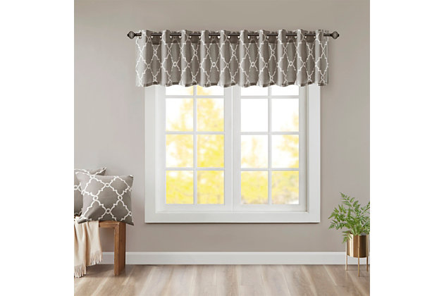 For a casual and stylish update, our Madison Park Saratoga Fret Print Window Valance is the perfect addition to any decor. This valance features a trendy soft beige fretwork on a light grey ground, creating a simple yet modern look. The cotton blend basket weave fabric softly filters the perfect amount of sunlight into your home, while providing texture for natural appeal. Silver grommet top detail makes this panel easy to hang, open, and close throughout the day. Fits up to a 1.25" diameter rod.Imported | Scroll geometric fretwork print design valance for window decor | Metallic print detailing on basketweave fabric | Valence dimension 50x18 inches | Silver grommet top finish fits up to 1.25 inches rod in diameter | Machine washable