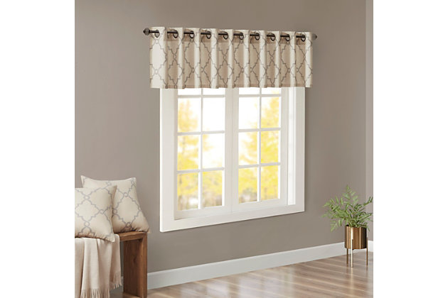 For a casual and stylish update, our Madison Park Saratoga Fret Print Window Valance is the perfect addition to any decor. This valance features a trendy soft grey fretwork on a light beige ground, creating a simple yet modern look. The cotton blend basket weave fabric softly filters the perfect amount of sunlight into your home, while providing texture for natural appeal. Silver grommet top detail makes this panel easy to hang, open, and close throughout the day. Fits up to a 1.25" diameter rod.Imported | Scroll geometric fretwork print design valance for window decor | Metallic print detailing on basketweave fabric | Valence dimension 50x18 inches | Silver grommet top finish fits up to 1.25 inches rod in diameter | Machine washable