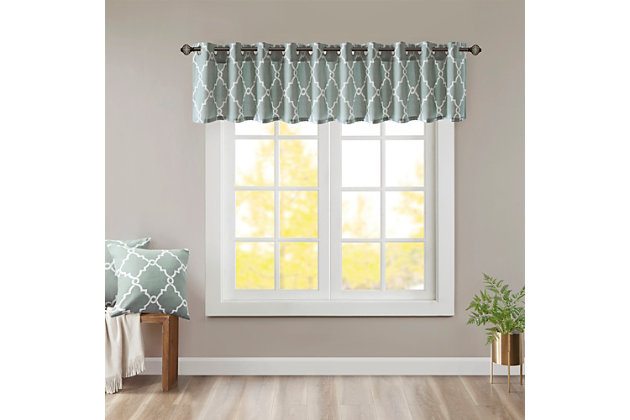 For a casual and stylish update, our Madison Park Saratoga Fret Print Window Valance is the perfect addition to any decor. This valance features a trendy light beige fretwork on a seafoam ground, creating a simple yet modern look. The cotton blend basket weave fabric softly filters the perfect amount of sunlight into your home, while providing texture for natural appeal. Silver grommet top detail makes this panel easy to hang, open, and close throughout the day. Fits up to a 1.25" diameter rod.Imported | Scroll geometric fretwork print design valance for window decor | Metallic print detailing on basketweave fabric | Valence dimension 50x18 inches | Silver grommet top finish fits up to 1.25 inches rod in diameter | Machine washable