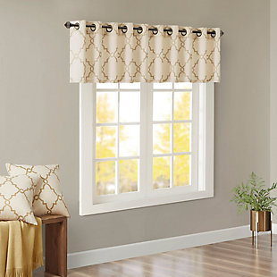 For a casual and stylish update, our Madison Park Saratoga Fret Print Window Valance is the perfect addition to any decor. This valance features a trendy metallic gold fretwork on a soft beige ground, creating a simple yet modern look. The cotton blend basket weave fabric softly filters the perfect amount of sunlight into your home, while providing texture for natural appeal. Silver grommet top detail makes this panel easy to hang, open, and close throughout the day. Fits up to a 1.25" diameter rod.Imported | Scroll geometric fretwork print design valance for window decor | Metallic print detailing on basketweave fabric | Valence dimension 50x18 inches | Silver grommet top finish fits up to 1.25 inches rod in diameter | Machine washable