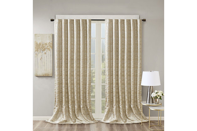 SunSmart Cassius Jacquard Total Blackout Panel is the perfect update to your windows, with its stunning beauty and functional style. This elegant window panel flaunts a marble jacquard design in rich grey and silver hues creating a luxurious sheen, for a lavish look. A high-quality woven lining blocks out all sunlight, provides a maximum protective barrier against noise intrusion, and offers a maximum level of privacy and energy savings. With 100% total blackout properties, this window panel is the perfect addition for bedrooms, media rooms, or any private spaces. The rod pocket top and back tabs create a clean finish to your window giving your home a gorgeous touch of luxury. Fits up to a 1.25” diameter rod. Lighting level: Pitch Black Ambiance. Complete the look with coordinating valance, sold separately.Imported | Contemporary total blackout curtain panel in marble jacquard fabric | Luxurious and sheen in luxury color hues | Heavy duty dual face liner for total blackout | Block out all sunlight and exterior light, noise reduction & privacy | Energy efficient to retain room temperature | Lighting level - pitch black ambiance | Perfect for bedroom, media room or any private space | Machine washable