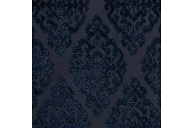 Give your home the lavish style and energy efficiency it deserves with the SunSmart Mirage Knitted Jacquard Total Blackout Panel. This elegant window panel flaunts a knitted jacquard damask design in a rich grey ground with navy burnout pattern, creating a luxurious sheen and texture. The heavyweight fabric features a foam-back and bonding finish that blocks out all sunlight and provides a maximum protective barrier against noise intrusion. With 100% total blackout properties, this window panel offers a maximum level of privacy and energy savings, which makes it perfect for bedrooms, media rooms, or any private spaces. A silver grommet top detail completes the look, while also making it easy to hang, open, and close the window panel throughout the day. Fits up to a 1.25” diameter rod. Lighting level: Pitch Black Ambiance.Imported | Total blackout grommet top curtain panel in knitted jacquard damask design | Heavy weight fabric in foamback bonding finish on the reverse side | Block out all sunlight and exterior light | Silver grommet top that fits up to 1.25 inches rod in diameter | Maximum level of privacy, energy saving and block noise intrusion | Great for bedroom, media room or any private space | Need to purchase 2 curtain panels for each window | Machine washable