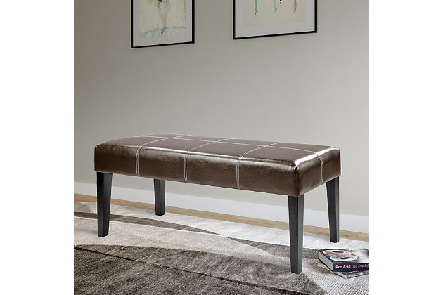 Enjoy a decorative combination of design and function with this entryway bench, while adding a touch of style to your home decor. Featuring a comfortable foam padded seat surface of dark brown bonded leather and finished with contrasting white top stitching, this bench can be used as a beautiful seat at the foot of the bed or as a functional piece in the entryway.Made of wood, foam and faux leather | Brown faux leather upholstery | Wood frame with espresso brown finish | Foam-filled seat | Contrasting top stitch design | Imported | Assembly required