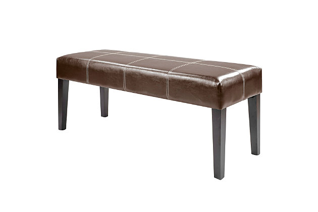 Enjoy a decorative combination of design and function with this entryway bench, while adding a touch of style to your home decor. Featuring a comfortable foam padded seat surface of dark brown bonded leather and finished with contrasting white top stitching, this bench can be used as a beautiful seat at the foot of the bed or as a functional piece in the entryway.Made of wood, foam and faux leather | Brown faux leather upholstery | Wood frame with espresso brown finish | Foam-filled seat | Contrasting top stitch design | Imported | Assembly required
