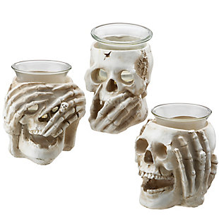 These creepy candleholders each feature a skull with bone hands depicting hear-no-evil, speak-no-evil, see-no-evil expressions. They are constructed of sturdy poly-resin material finished in eerie detail and topped with a glass bowl to hold a tea light style candle. This spooky set will help decorate the scene for Halloween.Set of three | 3.5" height | Halloween-themed tabletop decoration | Constructed of sturdy poly-resin material | Each glass bowl holds a tea light candle