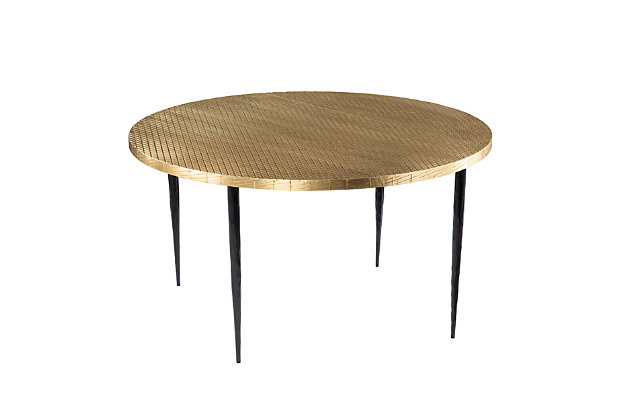Bring handcrafted style into your space with this round coffee table. An embossed brass-tone decorates the spacious tabletop in a unique crisscross pattern, while forged iron legs add a touch of industrial flair. Blending one-of-a-kind design with contemporary styling, this metal cocktail table works beautifully in front of your living room sofa or as an accent piece in your open concept space. Your home gets a chic upgrade with this handmade coffee table.Made with engineered wood and iron | Top with brass-tone finish | Hand-forged legs | Handmade design for a one-of-a-kind look | Assembly required