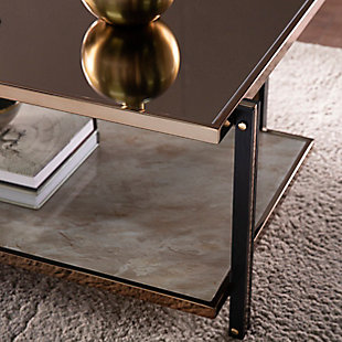 Reflect on your good taste with this mirrored cocktail table. The spacious tabletop offers a clean design, while the lower shelf keeps books and magazines tidy. A champagne-tone frame wraps around the smoky mirrored tabletop, crafting an elegant design in front of your living room sofa or alongside a pair of armchairs in the den. Add extra storage without sacrificing your style when you bring home this mirror-topped and faux marble cocktail table.Made of engineered wood, metal and glass | Top with smoky mirrored effect | Faux marble shelf | Champagne-tone finish on frame | Assembly required