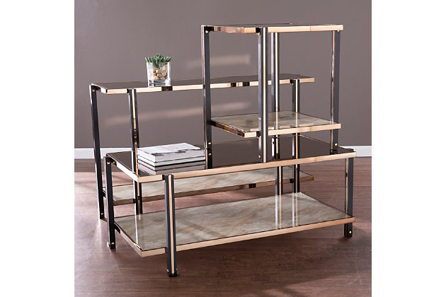 Reflect on your good taste with this mirrored cocktail table. The spacious tabletop offers a clean design, while the lower shelf keeps books and magazines tidy. A champagne-tone frame wraps around the smoky mirrored tabletop, crafting an elegant design in front of your living room sofa or alongside a pair of armchairs in the den. Add extra storage without sacrificing your style when you bring home this mirror-topped and faux marble cocktail table.Made of engineered wood, metal and glass | Top with smoky mirrored effect | Faux marble shelf | Champagne-tone finish on frame | Assembly required