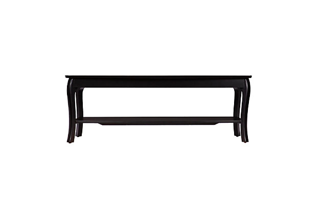 Welcome home sleek style with this black rectangular cocktail table. Spacious tabletop offers a clean design, while the lower shelf keeps books and magazines tidy. Center your living room design around display storage with this black coffee table.Made of wood and engineered wood | Black finish | 1 display shelf | Spacious tabletop | Curved legs | Assembly required