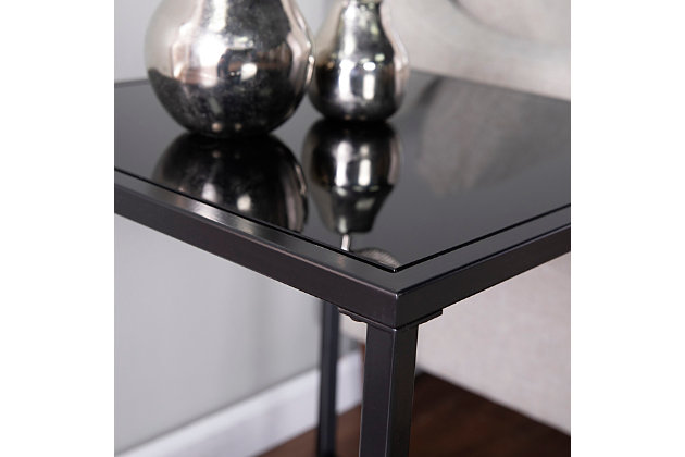 Display storage comes home with this glass-top side table. A faux marble shelf provides space for modern decor pieces, while the black glass tabletop holds a reading lamp or your cup of coffee. Designed for small spaces, this sleek end table slide neatly alongside your sofa or between a pair of armchairs. Elevate your contemporary decor when you add this square accent table to your living room or open concept space.Made of engineered wood, glass and metal | Black top | Frame with black finish | Shelf with black faux marble print | Geometric design | 1 open shelf | Small space friendly construction | Assembly required
