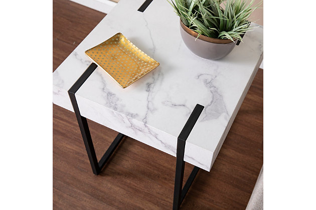 Add a hint of elegance to your space with this square side table. A faux marble tabletop easily displays a table lamp and your glass of wine, while sturdy iron legs give your decor a sleek, sophisticated feel. Enhance your small space with this faux marble end table collecting drinks and the TV remote alongside your living room sofa or keeping your favorite reads close at hand in your book nook. Contemporary style comes home with this two-tone accent table.Made of engineered wood and iron | Top with faux marble pattern | Inset black legs | Small space friendly design | Assembly required