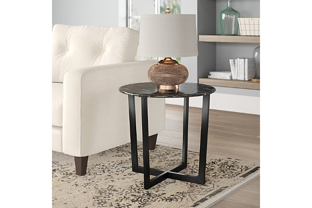 The Llona Round Side Table is arranged to have a two-dimensional appearance when viewed from certain angles. The beautiful black round marble top when paired with the powder coated base brings a polished look with a unique shape.Made of marble and steel | High-pressured laminated top with melamine | Powder coated base | Assembly required