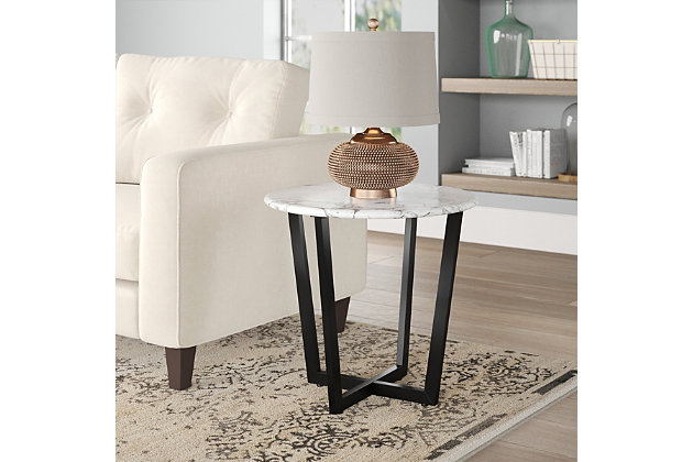 The Llona Round Side Table is arranged to have a two-dimensional appearance when viewed from certain angles. The beautiful white round marble top when paired with the powder coated base brings a polished look with a unique shape.Made of marble and steel | High-pressured laminated top with melamine | Powder coated base | Assembly required