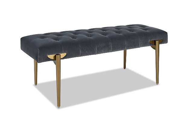 The Aria Accent Bench by Jennifer Taylor Home is a glamorous statement perfect wherever you need additional seating. The performance velvet upholstery is durable and soft, great for homes with kids and pets, and is complemented by the satin goldtone legs. Use this bench as a dining banquette to complete your dining set, or as a cocktail ottoman in your living room, or in your bedroom at the end of your bed.Handmade by master furniture craftsmen for the highest level of quality | Sturdy frame of kiln-dried solid birchwood and layered plywood provides excellent support and stability | Upholstered in performance velvet atop a high-density foam cushion for a firm feel | Seat is hand-tufted for a crafted, detailed look | Add an element of glam with the satin gold legs | Great in the living room, entryway, or bedroom