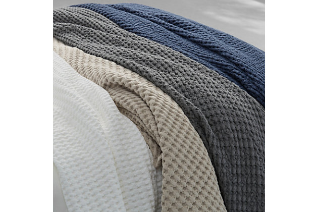 Crafted in Portugal from exceptionally fine 100% Cotton yarns, the Pebble Beach Throw offers Malibu Beach House inspired indulgence and incredible comfort. Wrap yourself with a sumptuous throw blanket that is thoughtfully textured with a honeycomb weave and lightweight luster. Garment dyed in Earthen shades of white, chambre, navy, sand and stone for a gorgeous neutral layer to your bed, sofa, or armchair. Pair this stylish plush throw blanket with the White Sand collection to complete the look.Cotton features unique insulation properties that keeps you warm in the Winter, and breathability to keep you cool in the Summer | Yarns are of the highest quality, combed, long staples, providing long lasting comfort and durability | White Sand linens are crafted with a high level of complexity and detail, and embrace distinct Portuguese weaving looms that are a mastery of many generations | White Sand products are covered by OEKOTEX STANDARD 100 CLASS I, guaranteeing chemical-free environmentally friendly materials and packaging | 100% Cotton | Imported