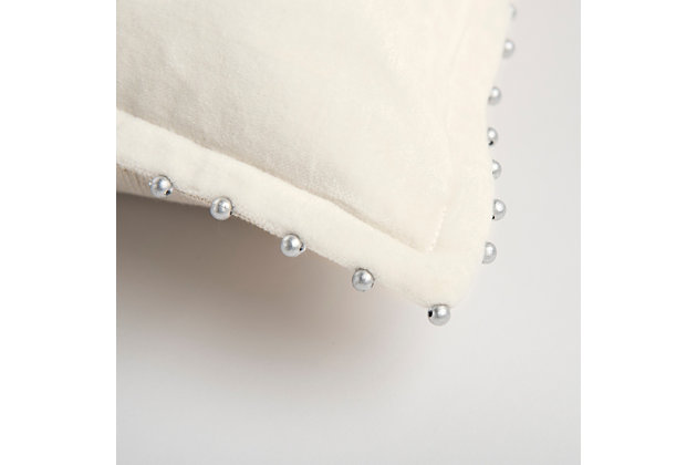 This pillow is 100% cotton velvet, featuring a ¾ inch self-flange. Silver pearlized beads are hand stitched to the edge of the flange. Every third bead is hand knotted to prevent the whole strand from demise should one bead break away. The back is natural burlap with a zippered closure for ease of fill and cleaning. This pillow is fabulous as a stand-alone design element and is also a great foundational layering element.Cotton velvet | Silver beaded trim | Three quarter inch flange | beading is hand knotted to prevent total bead disaster should one bead be compromised | solid coordinating back with hidden zipper closure | 100% Cotton