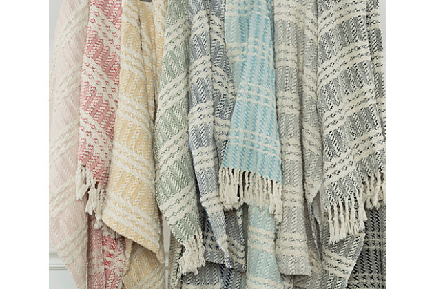 This handcrafted light weight throw is perfect for a spring evening wrap. It appears heathered because of the hand loomed technique and shows both horizontal and vertical patterning stripes. The weave is tight and secure. The self warp hand tied tassel fringe is approximately 2 1/2 inches long. The selvage edges are hemmed.hand loomed cotton | artisinally hand crafted | warp hand tied tassel fringe | medium texture | light weight | 100% Cotton