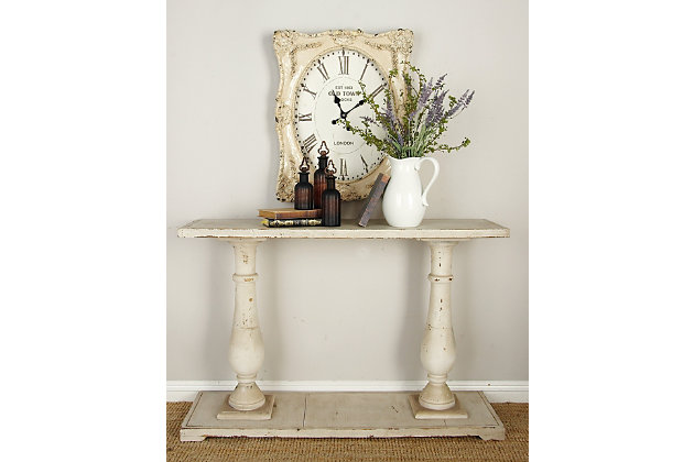 This wood console table will elevate your farmhouse style living room. Use this charming table as an accent piece in the living room, library or hallways of your home.Made of wood | Distressed eggshell finish | Decorative distressing and chipping | Assembly required