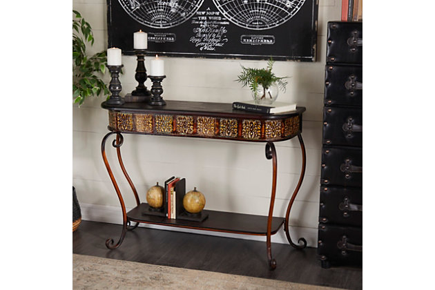 Useful and elegant, console tables are more than just a place to throw your mail. Use it as an accent piece in the living room, library, or hallways of your home. Made with wood | Dark russet brown finish | Metal frame with dark brown finish | Assembly required