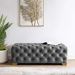 Refresh your entryway or living room decor with the Sensible bench. Deep button tufting covers the full expanse of Sensible’s soft, stain-resistant performance velvet upholstery. Generous dense foam padding provides a luxurious seating experience, while four goldtone stainless steel legs with non-marking foot caps provide reliable support.Performance velvet polyester upholstery | Durable stain-resistant fabric | Elegant deep button tufting | Goldtone stainless steel legs | Dense foam padding | Non-marking foot caps