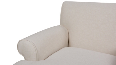 close-up of beige armrest cushion and fabric