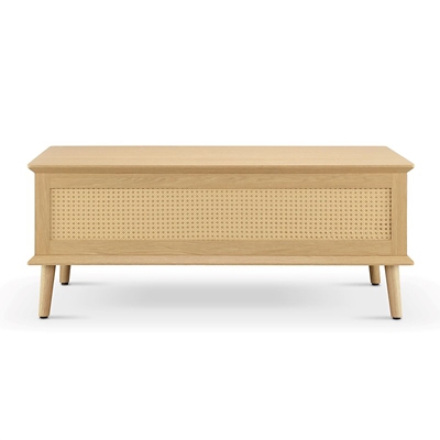Front view of a wooden coffee table with a rattan panel on the front and tapered legs.