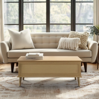 Living room scene with beige sofa and central lift-top coffee table with two side tables.