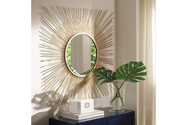 The Elspeth accent mirror is a contemporary musing. Breathtaking sunburst design shines in goldtone metal. Beautifully large scale makes this piece the center of attention.Mirrored glass with goldtone metal | Keyhole bracket hanger | Clean with a soft, dry cloth