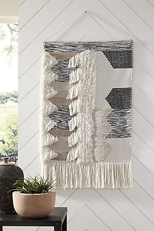 Dream weaver. What else would you call this wonderfully textural tapestry in soothing neutral tones? Channeling the spirit of boho-chic design, this wall hanging will add interest to your wall-scape, inside or out.Made of polyester | Shades of black, gray and natural | Indoor/outdoor safe | Braided cord for hanging