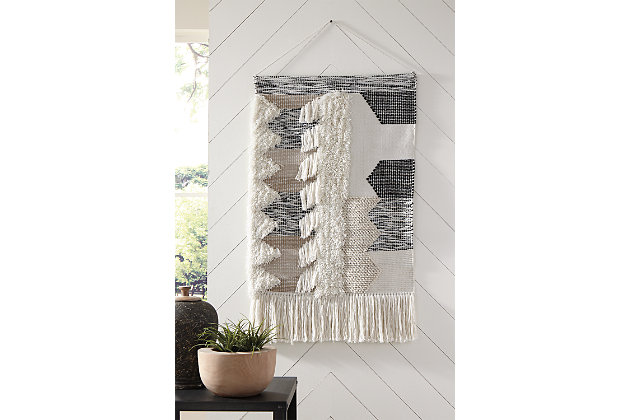 Dream weaver. What else would you call this wonderfully textural tapestry in soothing neutral tones? Channeling the spirit of boho-chic design, this wall hanging will add interest to your wall-scape, inside or out.Made of polyester | Shades of black, gray and natural | Indoor/outdoor safe | Braided cord for hanging