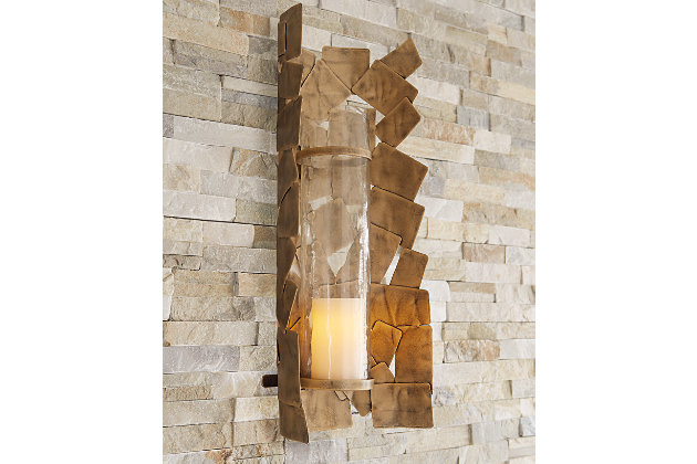 Light up your space with contemporary style with the Jailene wall sconce. The antiqued goldtone finish of the stacked shapes adds a classic element to this very modern piece. Add in your own candle and enjoy your very chic space.Made of metal and glass | Antiqued goldtone finish | Keyhole bracket | Ready for hanging