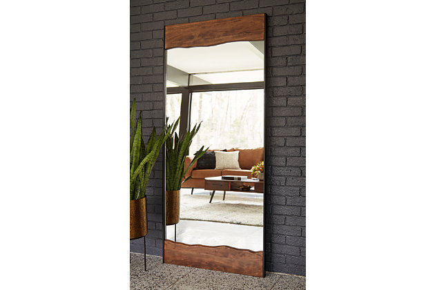 Simply striking and strikingly simple. The Panchali’s ultra clean lines and a mixed-media frame of brown finished wood and black finished metal make this floor mirror a complementary choice for so many spaces.Wood, mirrored glass and metal | Faux live-edge design | Keyhole hanger | Vertical handing only