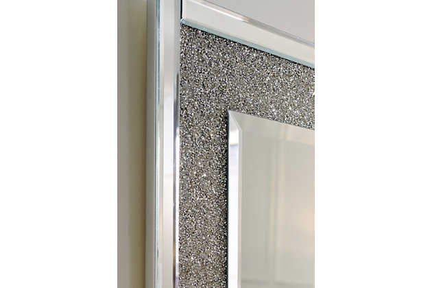 Subtle glitz and glam are in reach with this Kingsleigh accent mirror. Beautifully crafted with a cut glass outer frame with delicate crystal beading on the inner frame. The beveled center mirror floats inside the frame adding a soft sparkle to any room. Cut glass and beaded crystal accent mirror with bevel | D-ring bracket for hanging | Vertical and horizontal hanging
