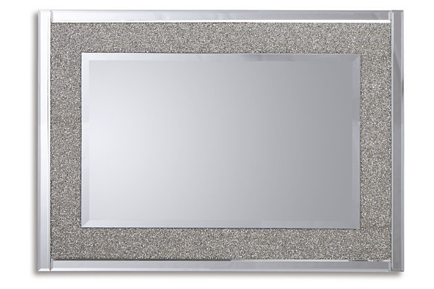 Subtle glitz and glam are in reach with this Kingsleigh accent mirror. Beautifully crafted with a cut glass outer frame with delicate crystal beading on the inner frame. The beveled center mirror floats inside the frame adding a soft sparkle to any room. Cut glass and beaded crystal accent mirror with bevel | D-ring bracket for hanging | Vertical and horizontal hanging