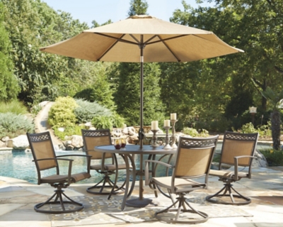 outdoor table with chairs and umbrella