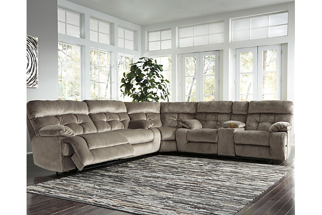 A scale means comfort with the Brassville sectional. Wondery wide seats are upholstered in a textural, cottony soft fabric. Recline as far back as you please on pillowy arms and headrests. Bustle back tufting adds the right amount of casually cool style. With a storage console and two convenient cup holders, you’ll want to stay here forever.Includes 3 pieces: 2-seat reclining sofa, wedge and double reclining loveseat with console | Reclining sofa and reclining loveseat with pull-tab reclining motion with adjustable positions | Console with storage and 2 cup holders | Corner-blocked frame with metal seat | Attached back and seat cushions | High-resiliency foam cushions wrapped in thick poly fiber | Polyester upholstery | Estimated Assembly Time: 10 Minutes