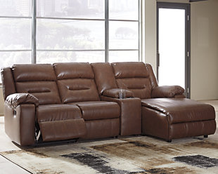 When you look as cool and feel as great as the Coahoma 4-piece sectional with power, it’s easy to make yourself at home. Proof that large-scale comfort doesn’t mean sacrificing high fashion, this decidedly modern sectional entices with clean lines, channel tufted styling and a chestnut brown upholstery that’s truly faux leather at its best. With space efficiency in mind, the sectional’s zero wall power recliner with USB plug-in at your fingertips provides the ultimate way to recline by design.Includes 4 pieces: right-arm facing corner chaise, armless chair, console with storage and left-arm facing zero wall power recliner | One-touch power control with adjustable positions | Corner-blocked frames; recliner with metal reinforced seat | Attached cushions | High-resiliency foam cushions wrapped in thick poly fiber | Zero wall recliner design requires minimal space between wall and chair back | Polyurethane/polyester/cotton interior upholstery; vinyl/polyester/polyurethane exterior upholstery | USB charging port | Power cord included; UL Listed | Estimated Assembly Time: 15 Minutes