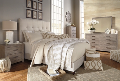 Serenity now. This queen upholstered bed is sure to awaken a love for modern platform styling with a softer side. Plush to the touch and so easy on the eyes, a pale beige fabric hugs the bed—from the chic headboard with square button tufting, to the low footboard and side rails, emanating the calming mood you long for in the bedroom. Mattress and foundation/box spring sold separately.Includes headboard, footboard and rails | Engineered wood frame | Polyester upholstery on headboard, footboard and rails | Square button tufting on headboard | Foundation/box spring required | Mattress available, sold separately | All parts required for assembly of this bed are packed in the open space in the back of the headboard | Estimated Assembly Time: 45 Minutes